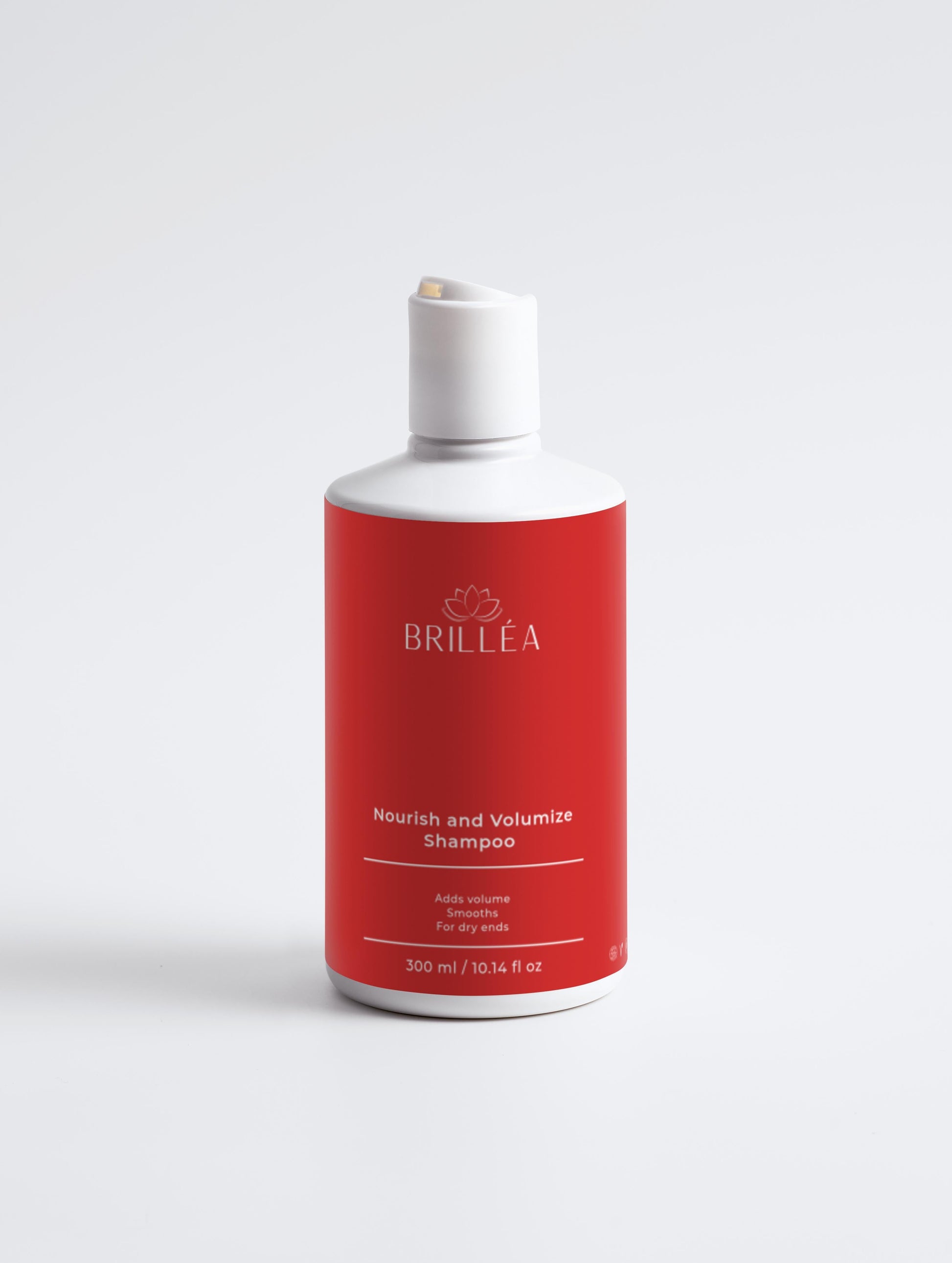 Nourish & Volumize Shampoo von ekovita für volles, gesundes Haar in eleganter Flasche.