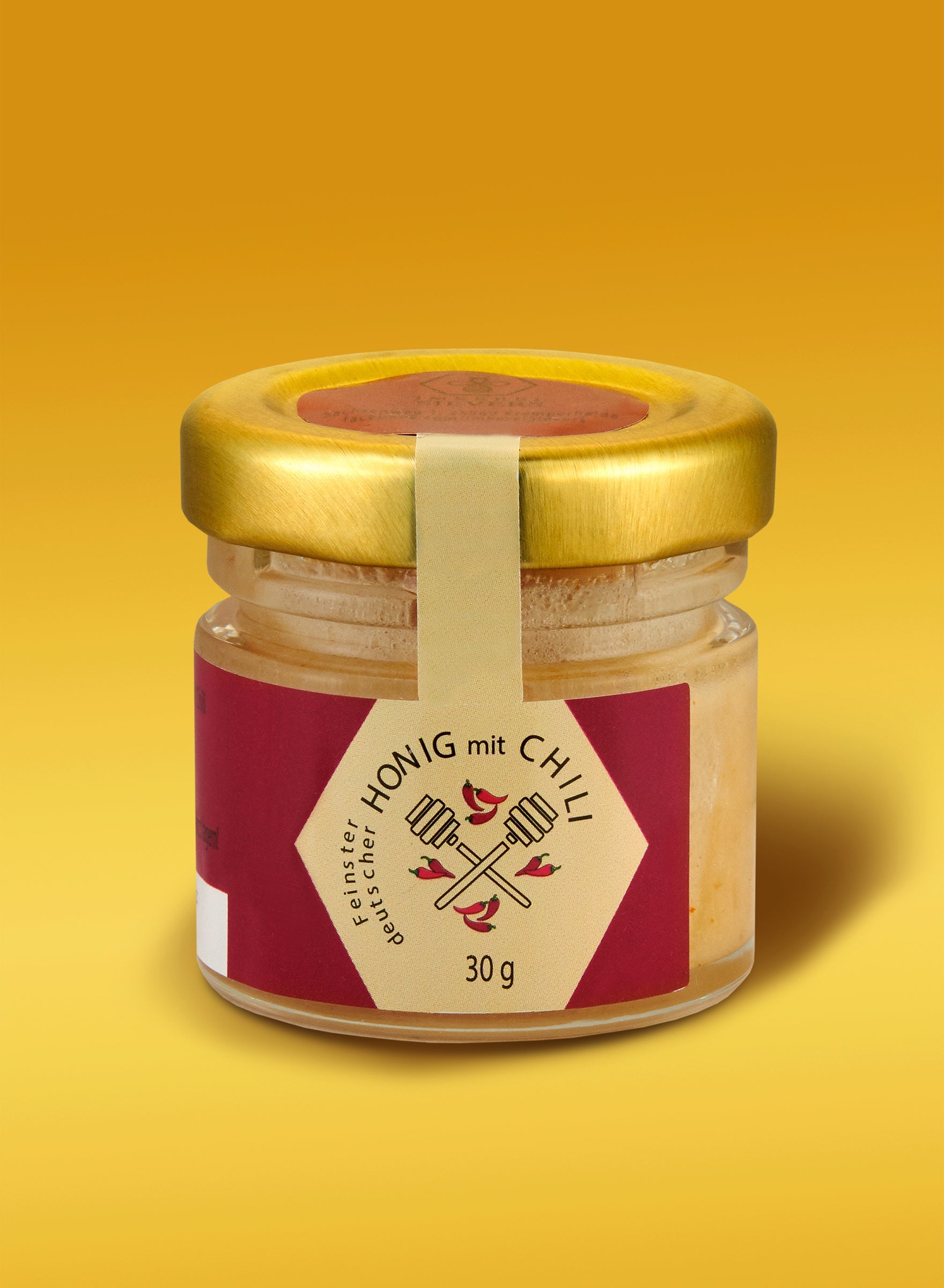 Ekovita Honig mit Chili in einem eleganten Glas, perfekt für feurigen Genuss.