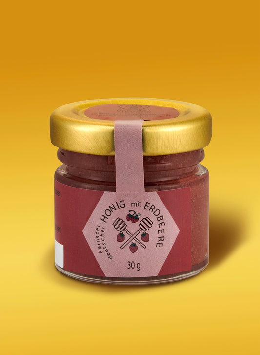 Ekovita Erdbeer-Honig im Glas, ein Premium Bienenprodukt aus Deutschland für fruchtigen Genuss.
