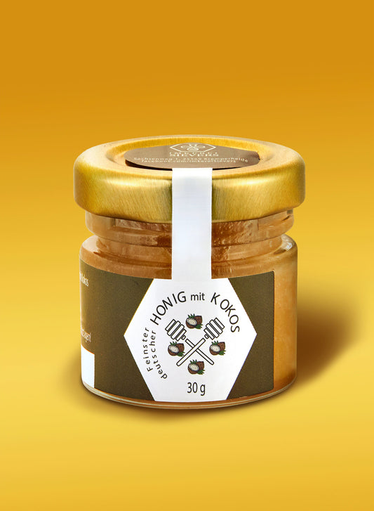 Honig mit Kokos von ekovita – Premium Honig in einem Glas, umgeben von frischen Kokosraspeln.