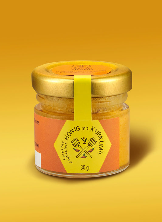 Kurkuma Honig von ekovita in einem Glasbehälter, Premium Naturprodukt mit goldener Farbe.