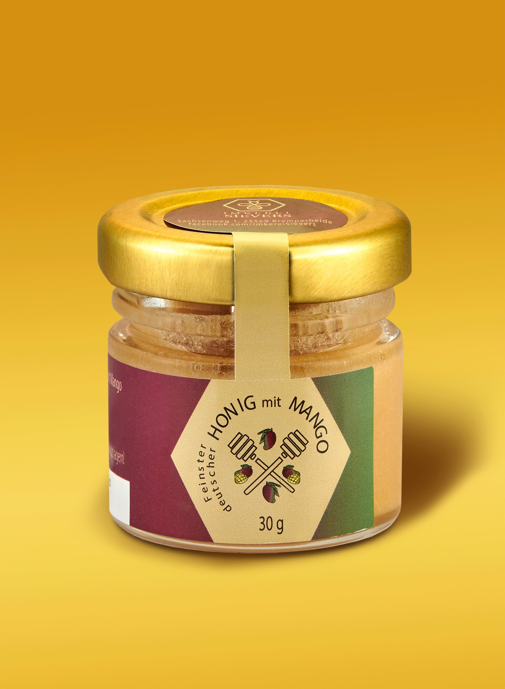 Ekovita Premium-Honig mit Mango von Nordbienchen in einer gläsernen Honigflasche.