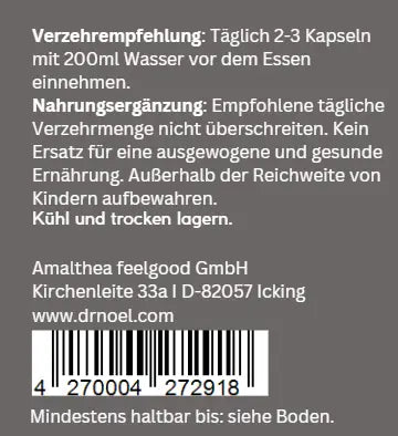 Taurin Kapseln auf einem Holzuntergrund, umgeben von frischen Kräutern und natürlichen Zutaten für Vitalität.